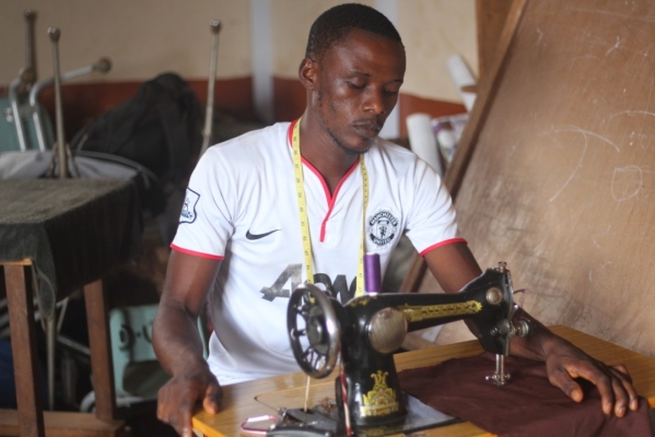 A man sewing