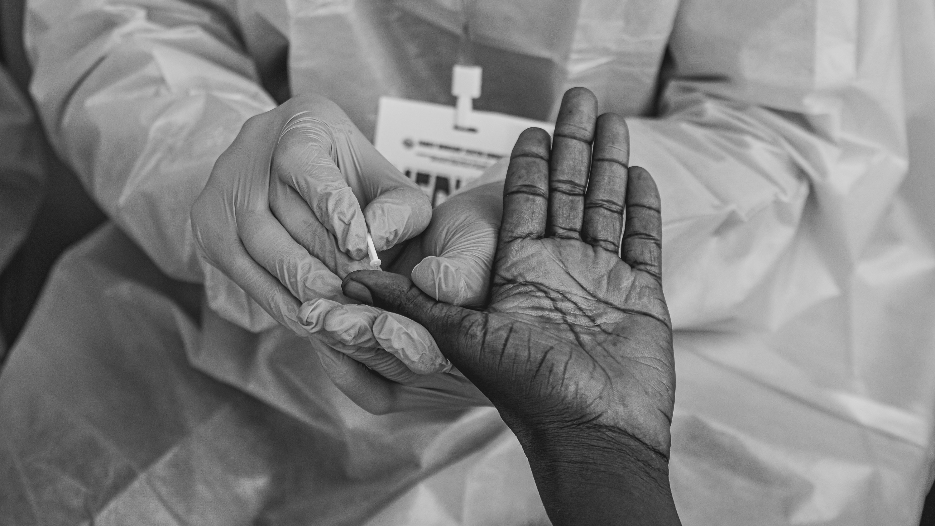 A healthcare practitioner testing a patient