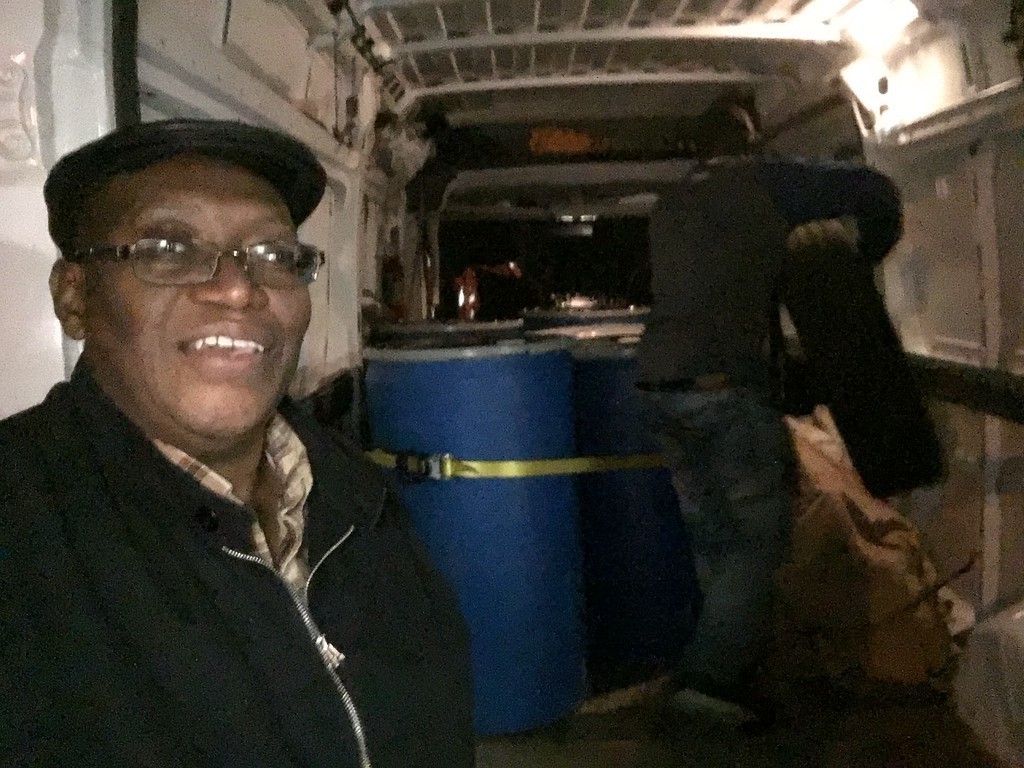 (c) 2016 Develop Africa. Sylvester and others packing supplies to be shipped out.