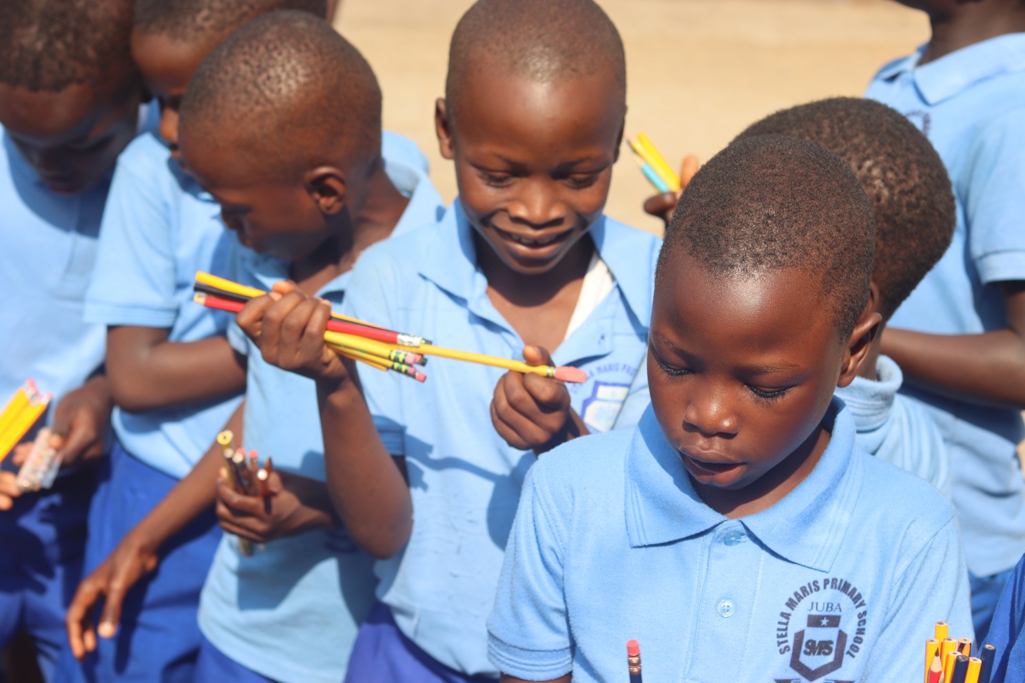 (c) Develop Africa. Children with pencils they received from Develop Africa as part of the Year of The Pencil campaign.