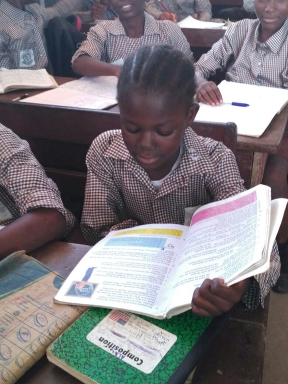 (c) Develop Africa. In too many places, early marriage and lack of education still steal girls’ futures. Girls in a classroom in Sierra Leone.
