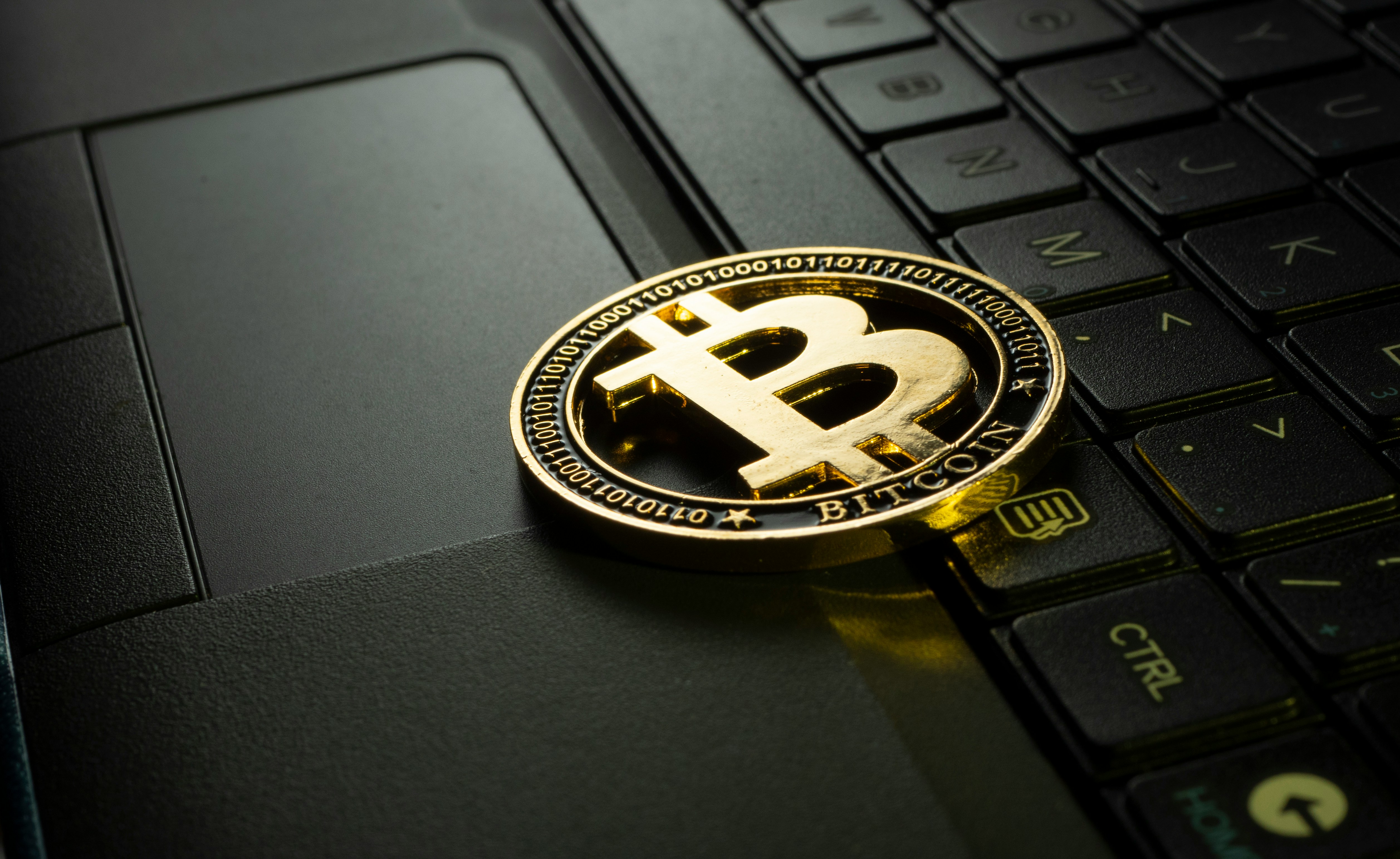 A bitcoin on a kryboard