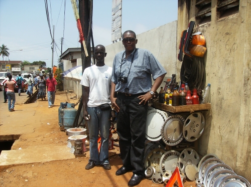 Sylvester and a trader in Sierra Leone, 2009