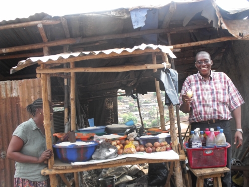 Sylvester and a trader in Sierra Leone, 2009