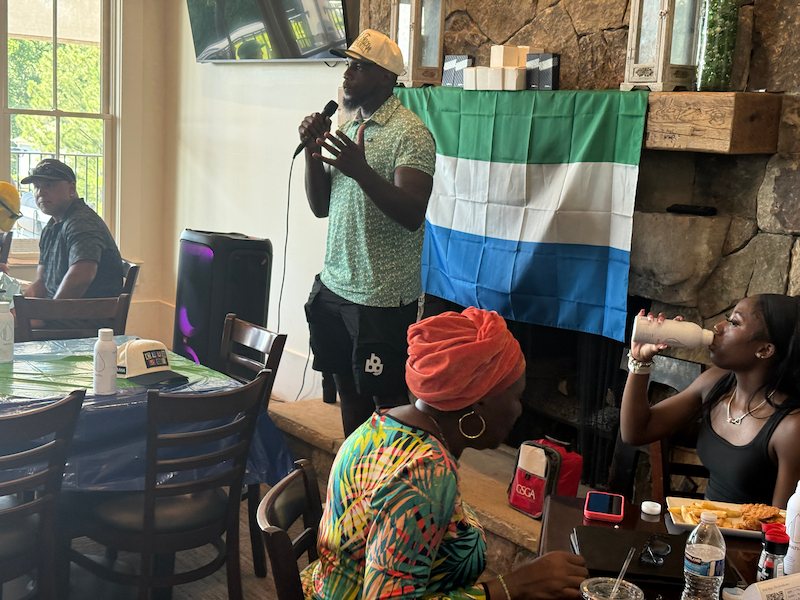 Mo Sanu giving speech at the Swing FORE Change 2026