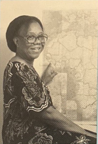 Zainabu Renner smiling beside a map of Africa, from the back cover of her 1996 book